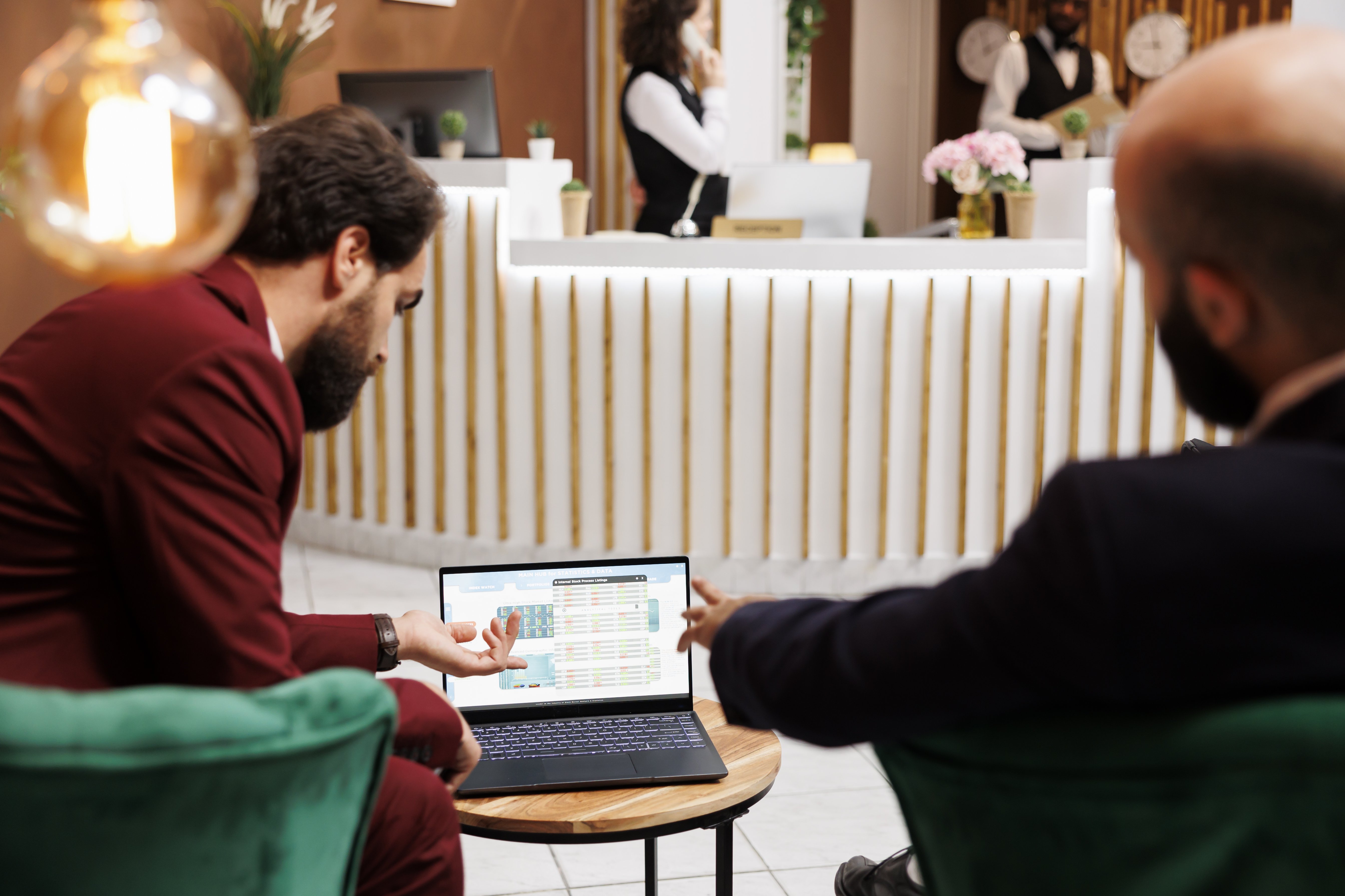 Enrtepreneurs exchanging ideas infront of laptop