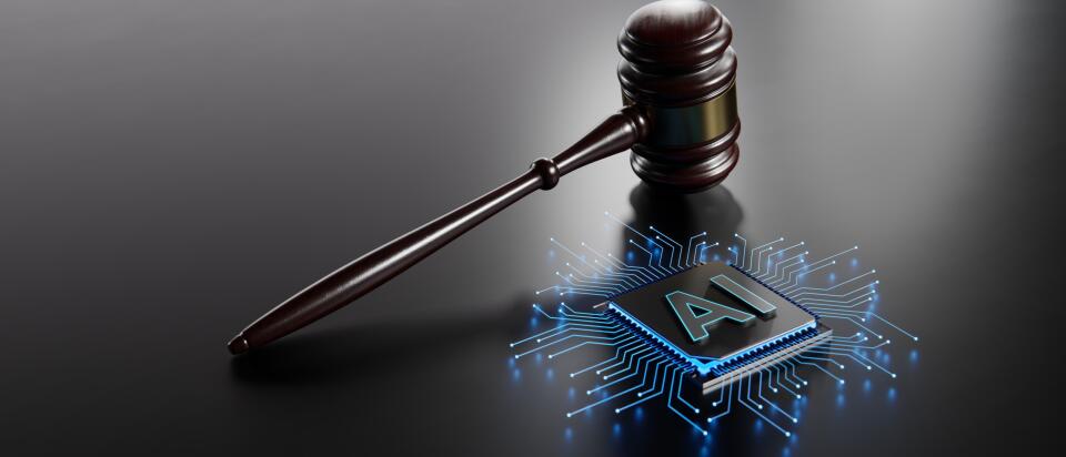 Dark wooden judge’s gavel beside a blue glowing microchip labelled “AI” on a reflective dark surface.